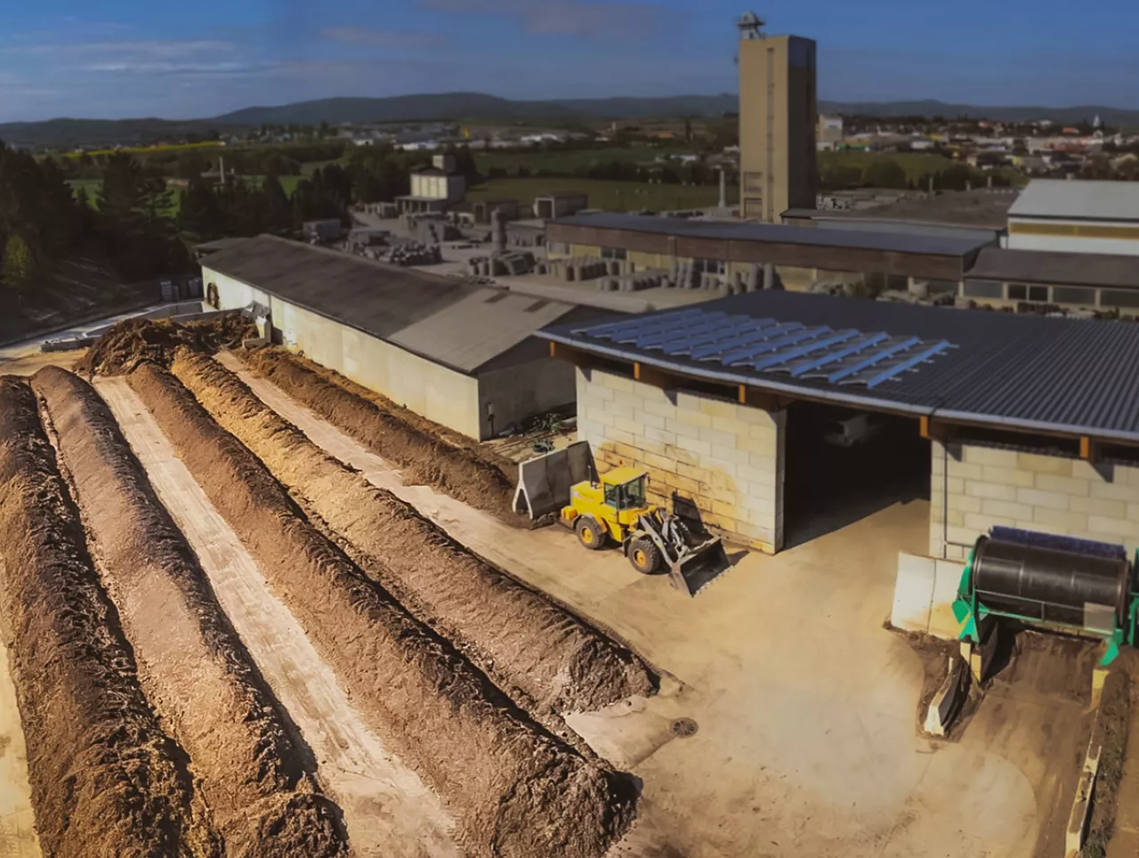 Open paved windrow composting